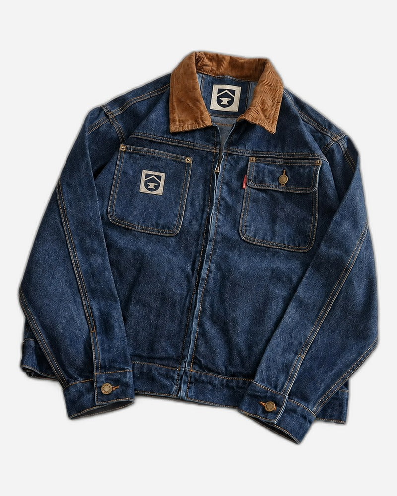 Heavyweight indigo denim workwear chore jacket with brown corduroy collar and chest patch pockets - front view